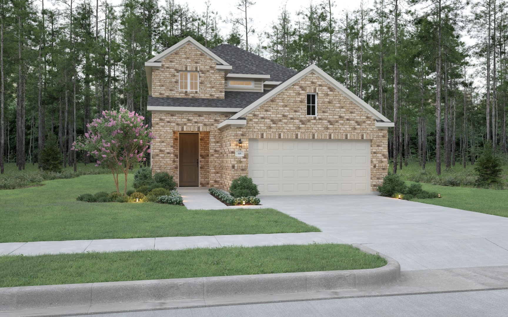 A two-story brick house with a two-car garage, surrounded by a well-kept lawn, bushes, and a small flowering tree, backed by tall pine trees. The driveway and walkway are visible in front.