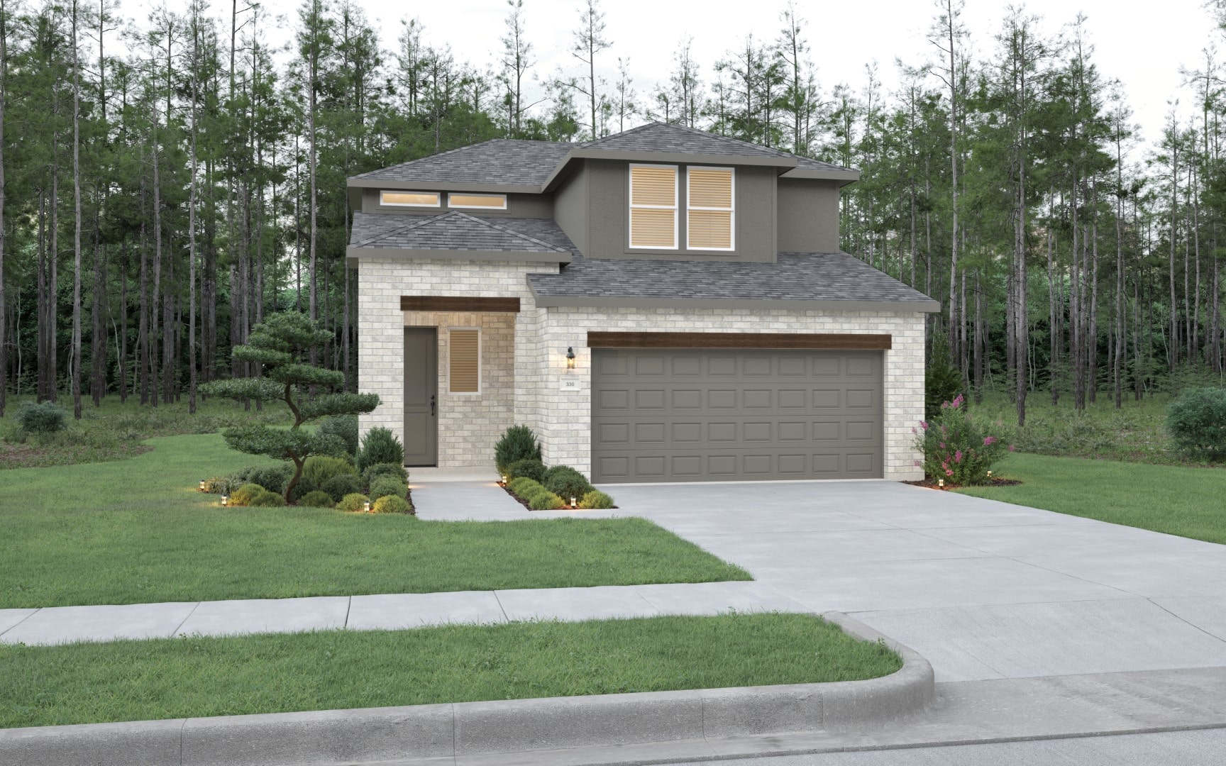Two-story modern house with light brick exterior, grey roof, and a two-car garage. Well-maintained lawn with trimmed bushes and a small tree. Forested area in the background. Concrete driveway in front.