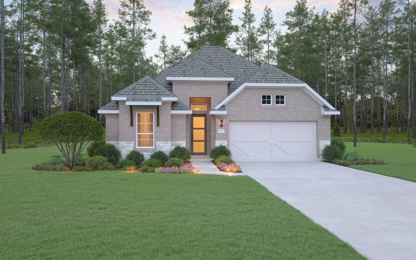 A modern single-story brick house with a double garage, large front windows, manicured lawn, landscaped bushes, and a concrete driveway, set against a backdrop of tall trees.
