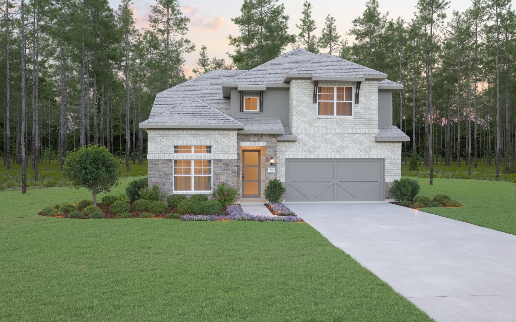 Two-story house with light brick and gray accents, a double garage, and a well-kept lawn with shrubs and flowers. Surrounded by tall pine trees and a clear sky in the background.