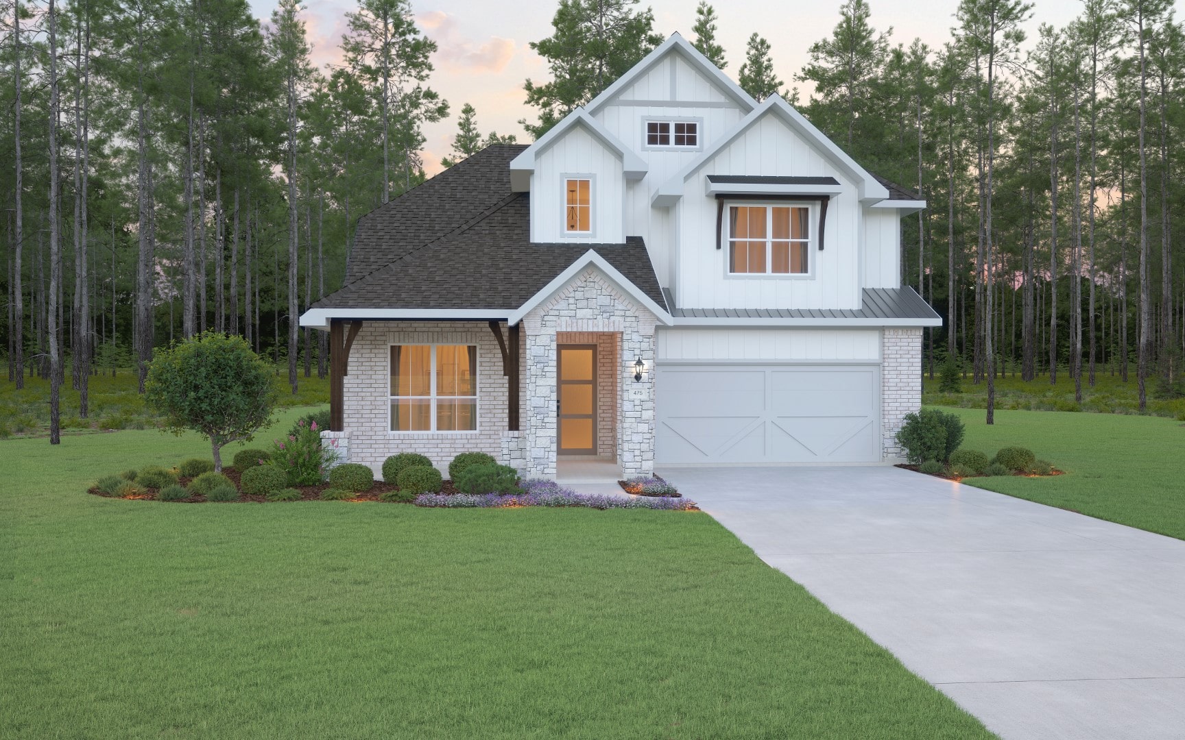 A modern two-story house with white siding, stone accents, dark roof, and an attached garage sits on a neatly landscaped lawn bordered by trees and shrubs, with a driveway leading to the front door.
