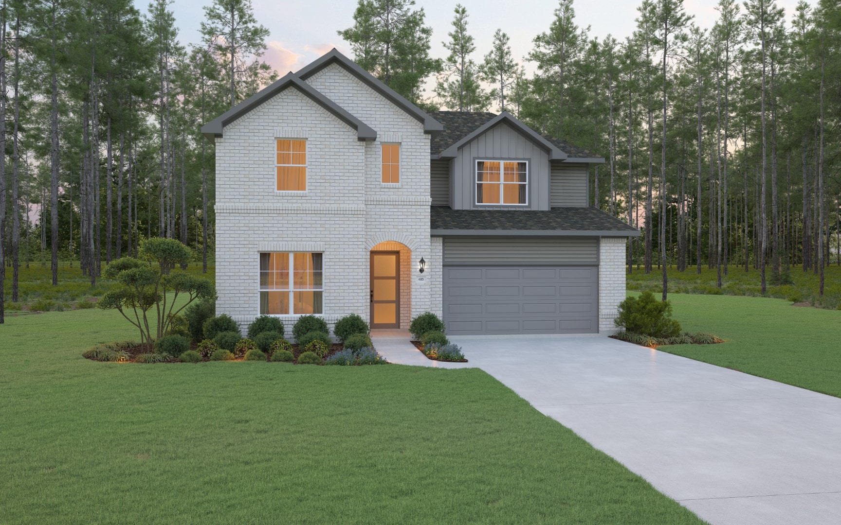 Two-story house with light brick exterior, dark gray roof, and a double garage. The home is surrounded by a green lawn, landscaped shrubs, and trees in the background. A wide driveway leads to the garage.