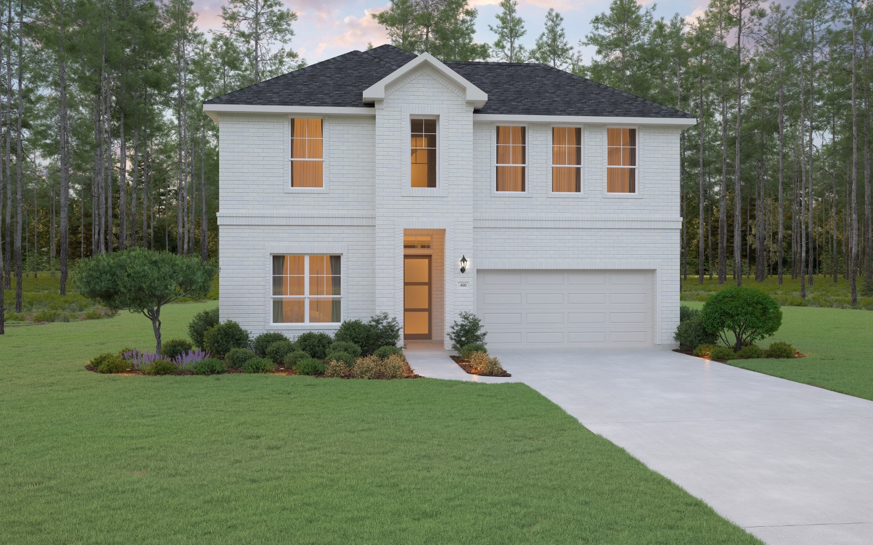 A two-story white brick house with large windows, a double garage, and a neatly landscaped front yard with bushes and a small tree, set against a backdrop of tall trees and a cloudy sky.