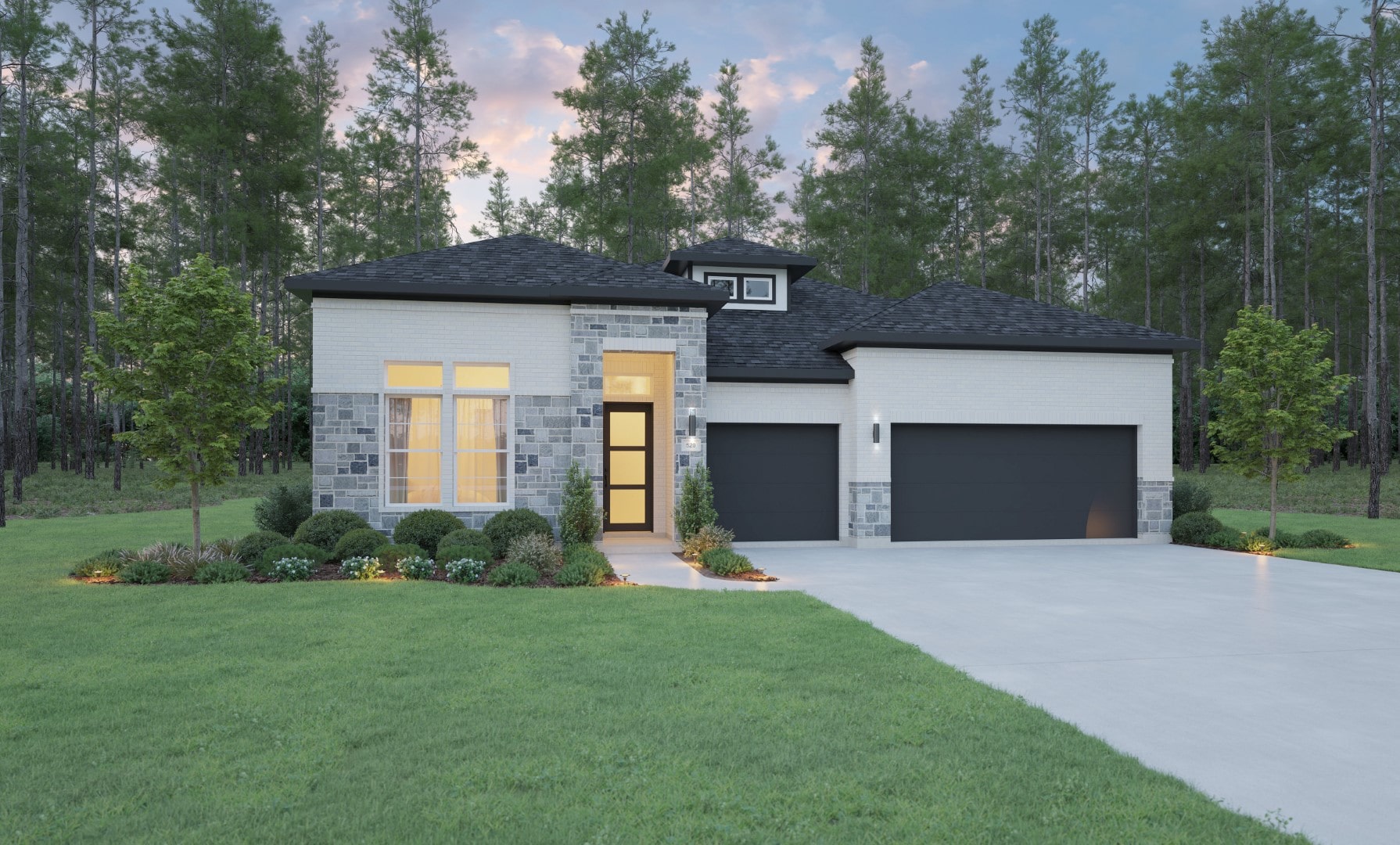 Modern single-story house with large windows, gray brick and stone exterior, black garage doors, and a well-kept lawn, surrounded by landscaped shrubs and trees, with a wooded forest in the background.