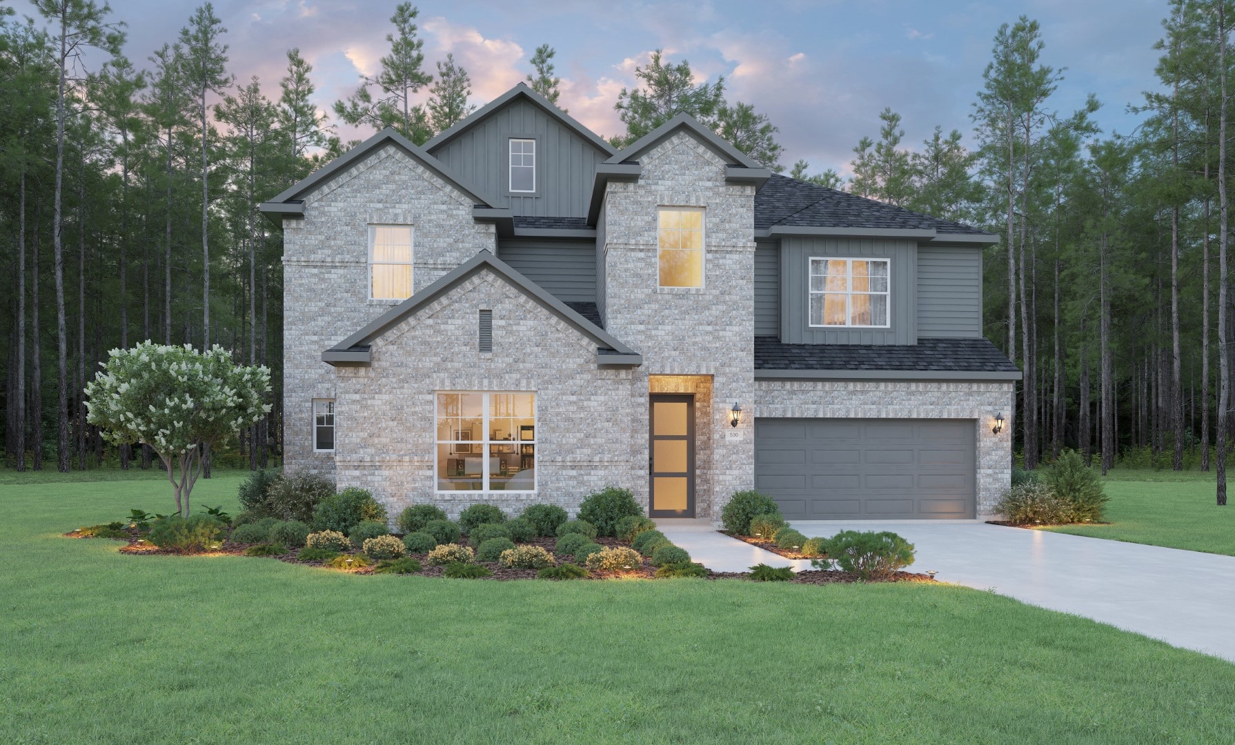 Two-story modern brick house with large windows, a two-car garage, landscaped front yard, and trees in the background under a partly cloudy sky at dusk.
